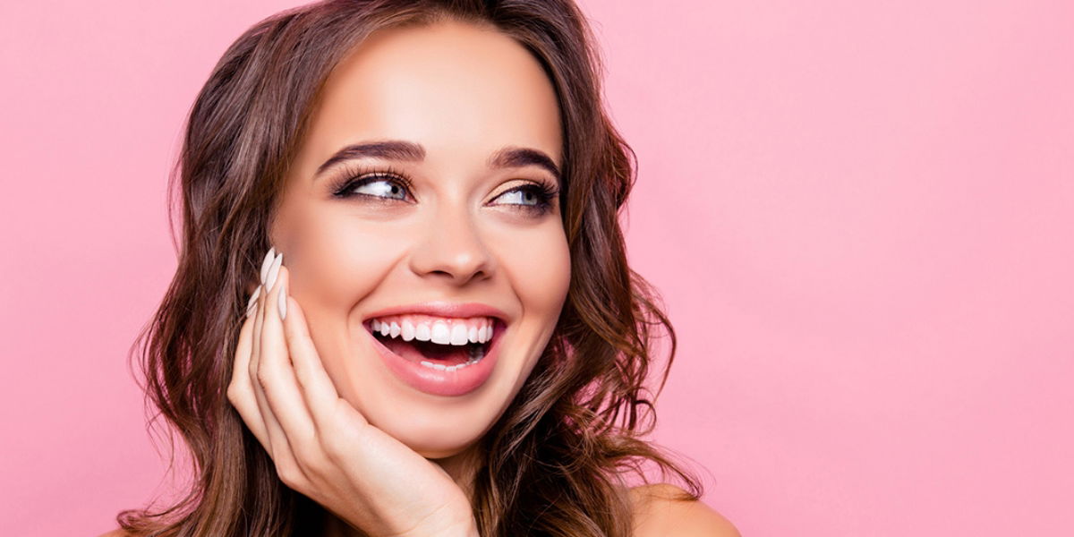 Young Female Model With Great Skin on Pink Background